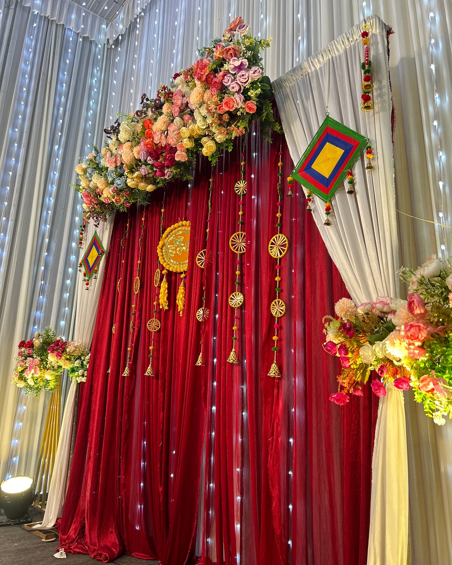 Festive draped backdrop with florals
